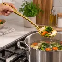 vague-stainless-steel-gold-slotted-serving-spoon-26-cm-lifestyle-1.jpg